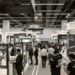 Event agency team reviewing a detailed checklist while managing exhibition setup and coordination